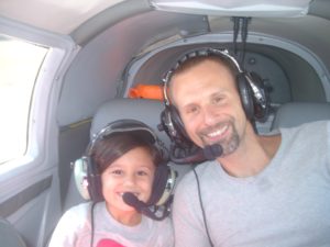 Pilot Charles George flying passenger Chris N. and his daughter Christina.